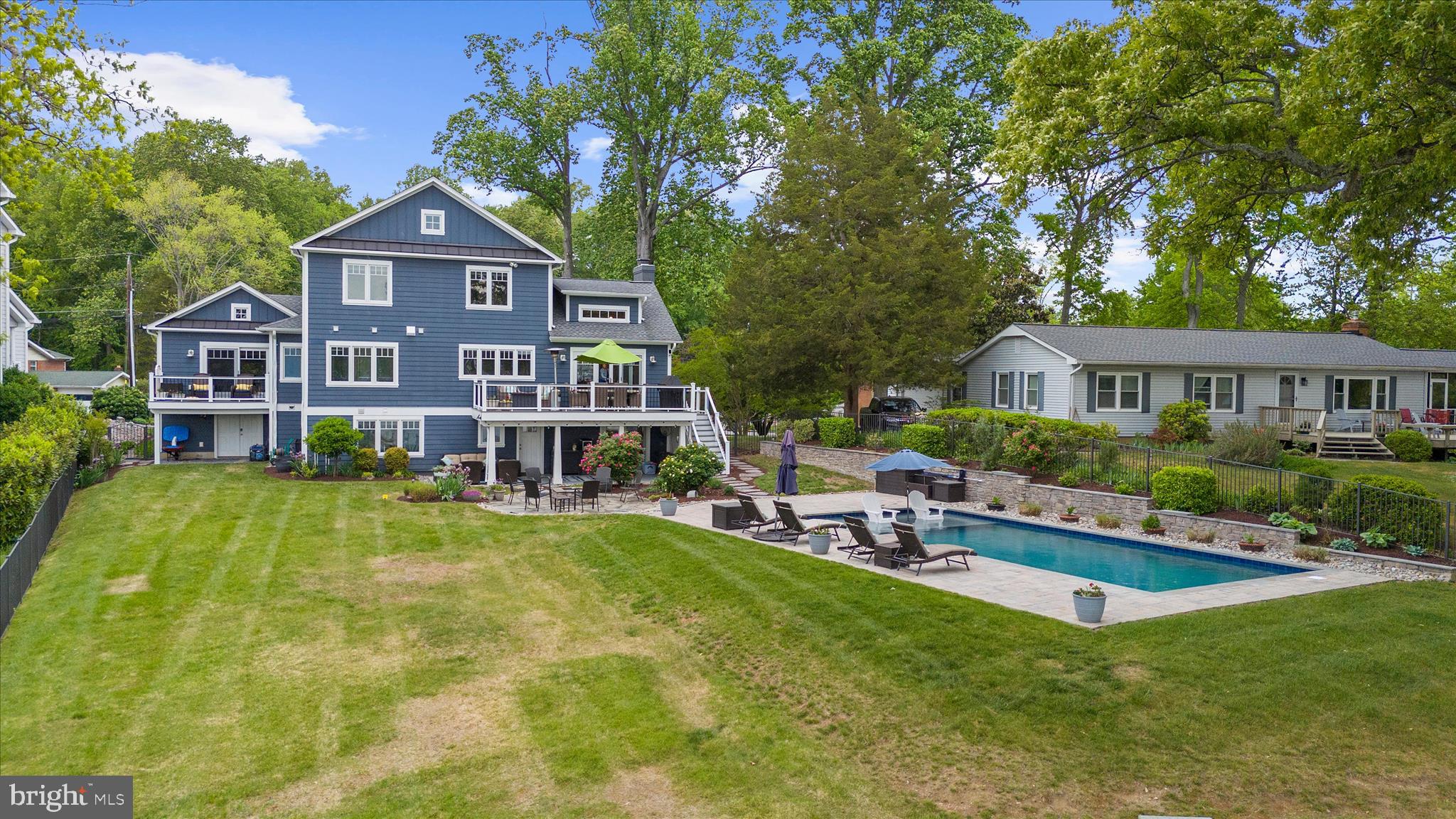 3815 Outrigger Drive Edgewater, MD 21037 - Photo 78 of 114 a front view of a house with swimming pool having outdoor seating