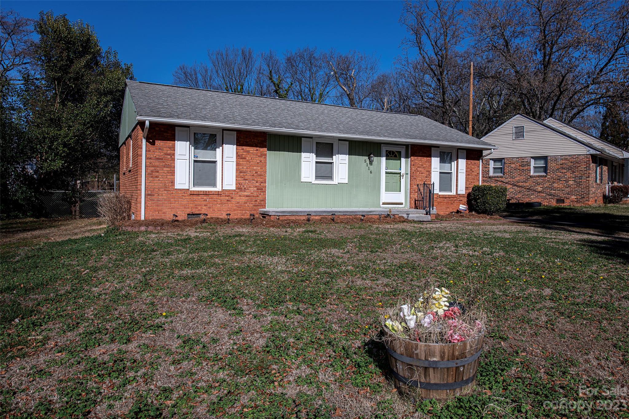 5116 Grapevine Drive Charlotte, NC 28217 - Photo 3 of 14 a front view of a house with a yard