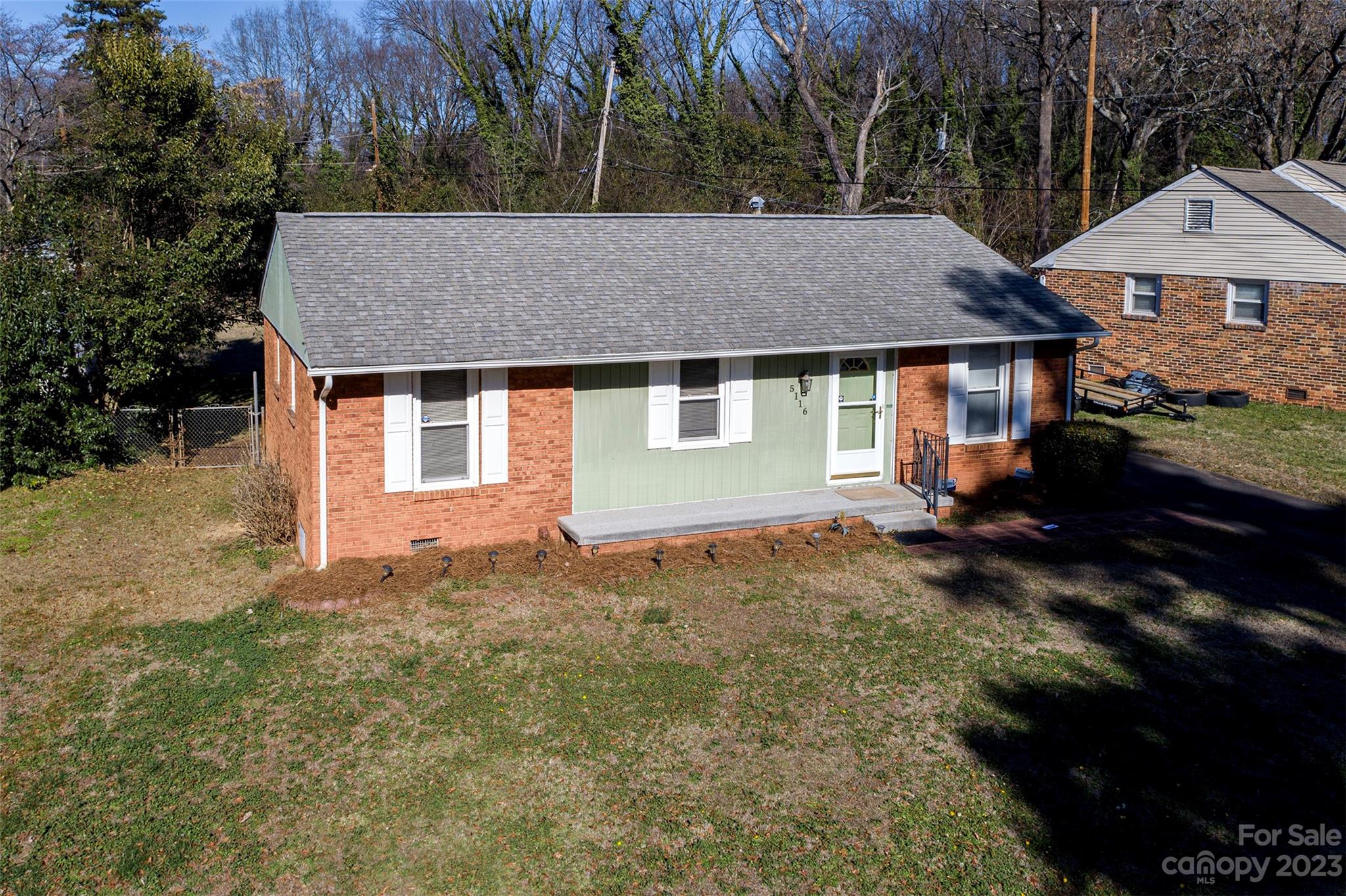 5116 Grapevine Drive Charlotte, NC 28217 - Photo 5 of 14 a house with trees in the background
