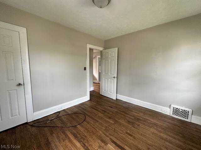 1752 South Taylor Road Cleveland, OH 44118 - Photo 8 of 14 Empty room featuring dark hardwood / wood-style floors