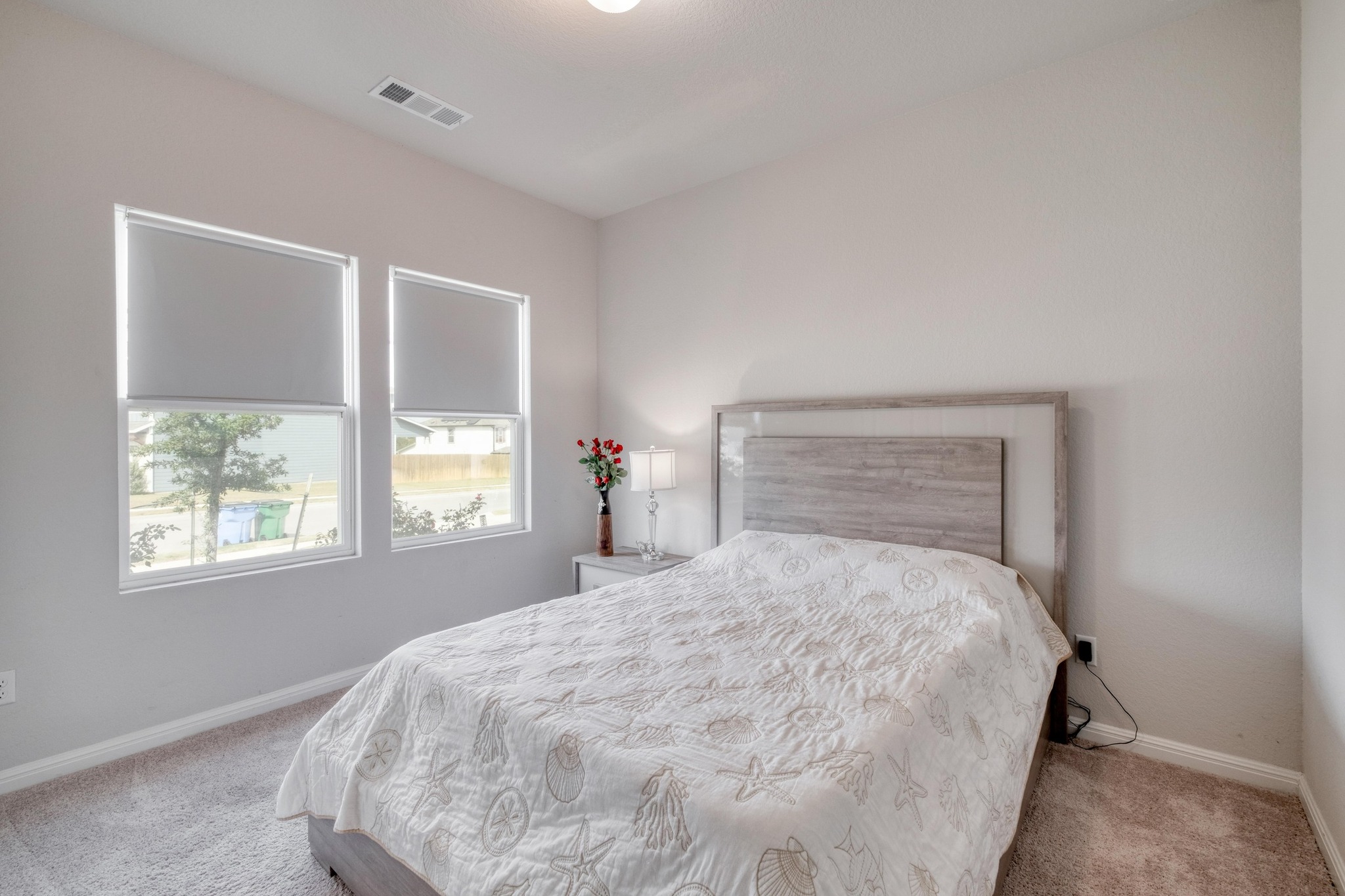 19425 Forman Drive Pflugerville, TX 78660 - Photo 16 of 25 Bedroom featuring carpet flooring and baseboards
