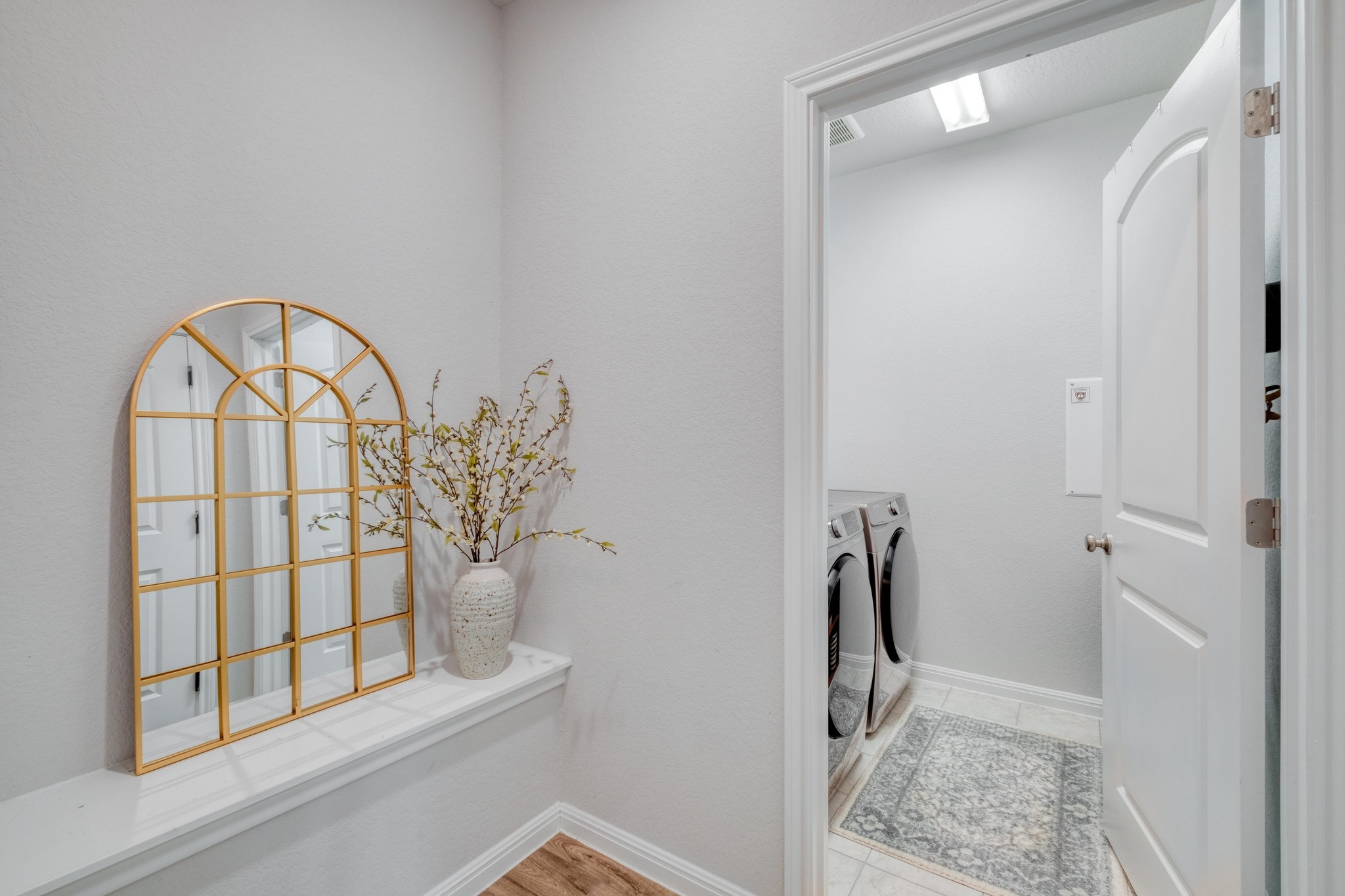 19425 Forman Drive Pflugerville, TX 78660 - Photo 18 of 25 Laundry room with washer and dryer and baseboards