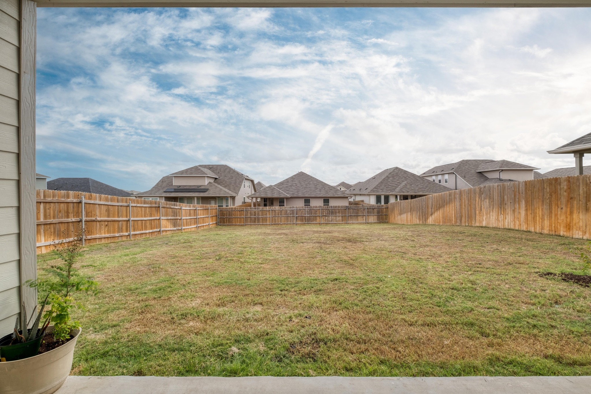 19425 Forman Drive Pflugerville, TX 78660 - Photo 20 of 25 Fenced backyard featuring a residential view