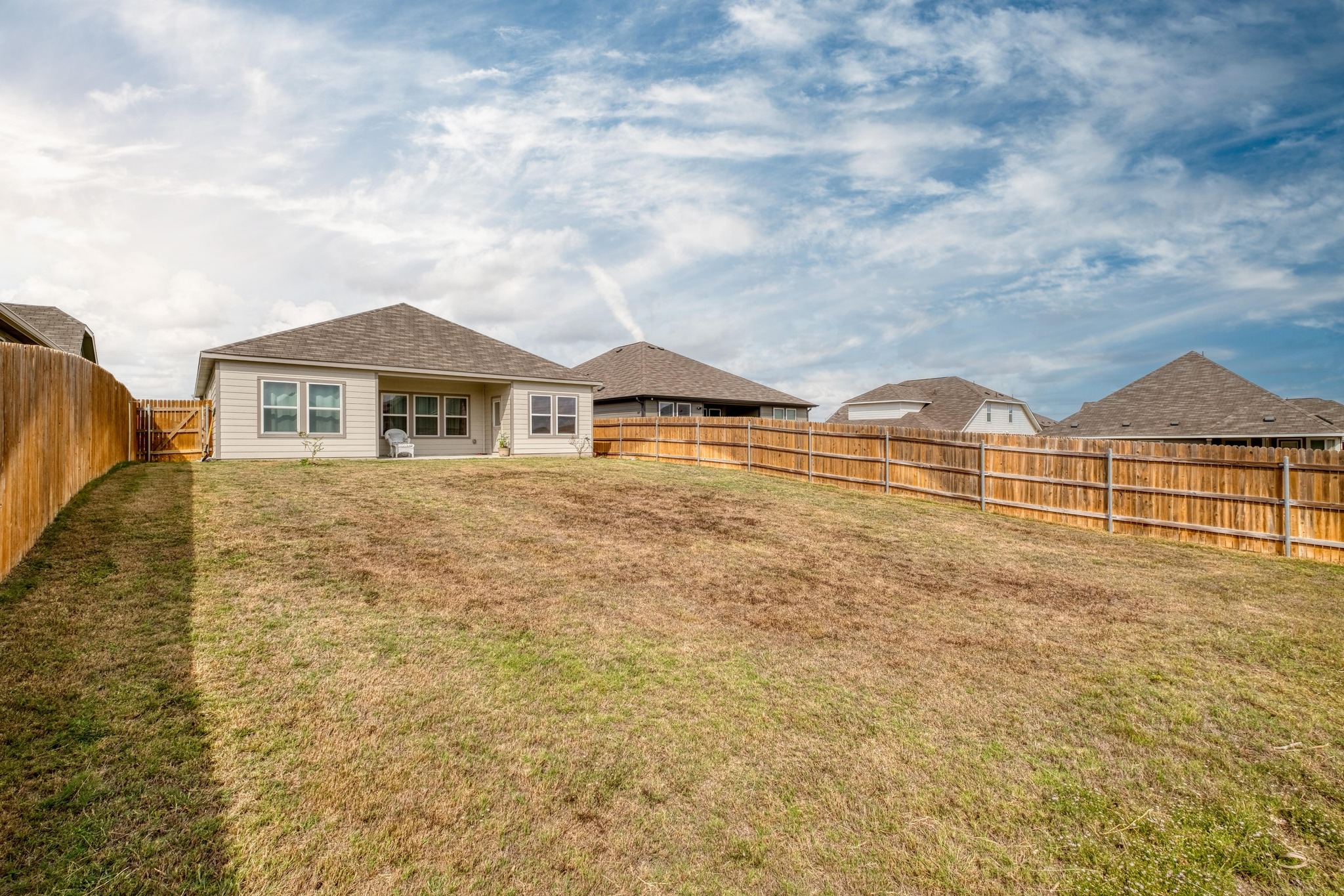 19425 Forman Drive Pflugerville, TX 78660 - Photo 22 of 25 Fenced backyard with a patio