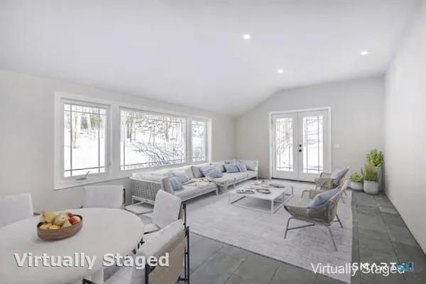 a living room with furniture and window