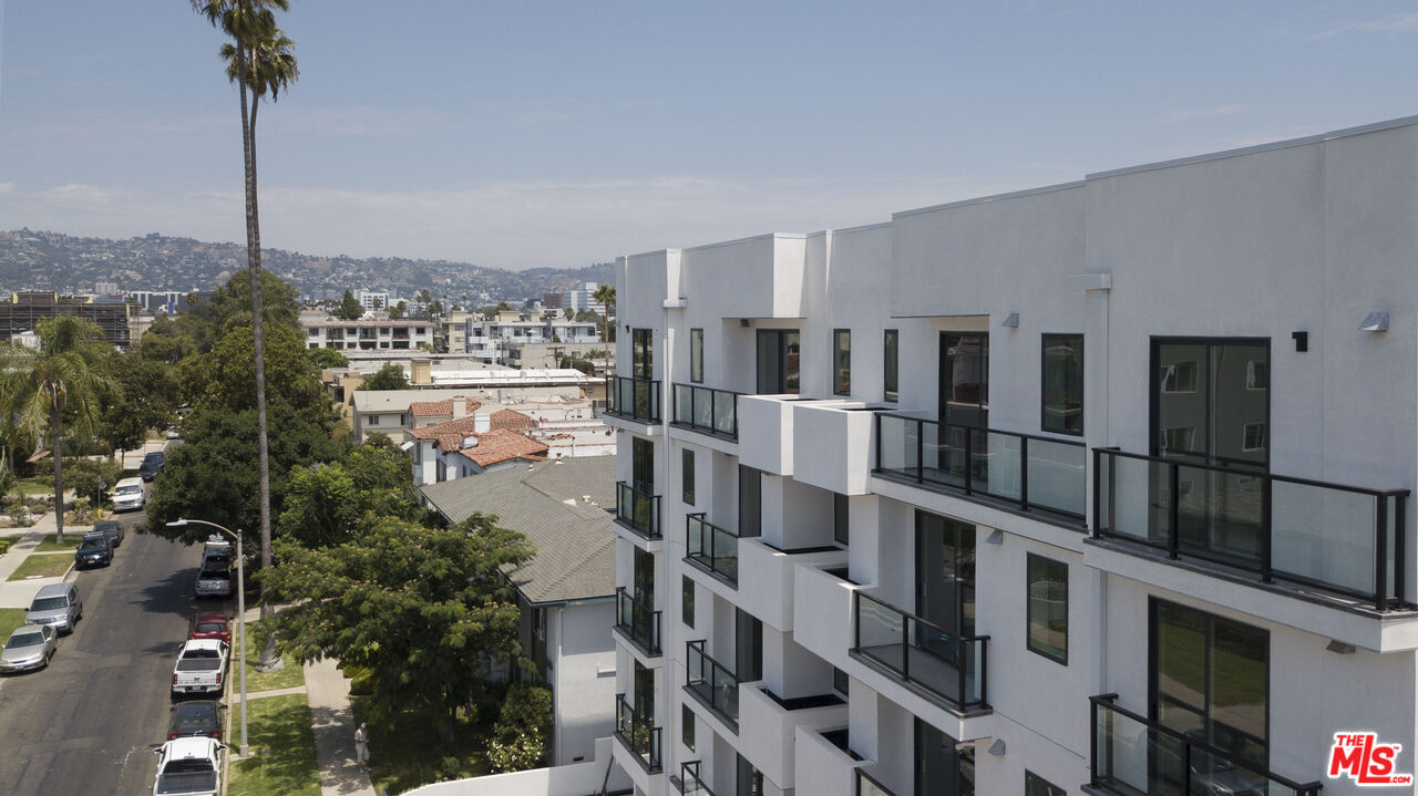 1226 South Bedford Street, Unit 502 Los Angeles, CA 90035 - Photo 16 of 16 a city view with tall buildings and a park