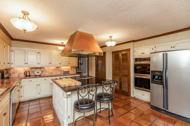 a room with furniture pool table and flat screen tv