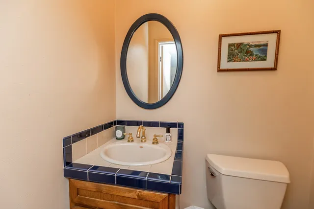 a spacious bathroom with a double vanity sink a mirror and shower