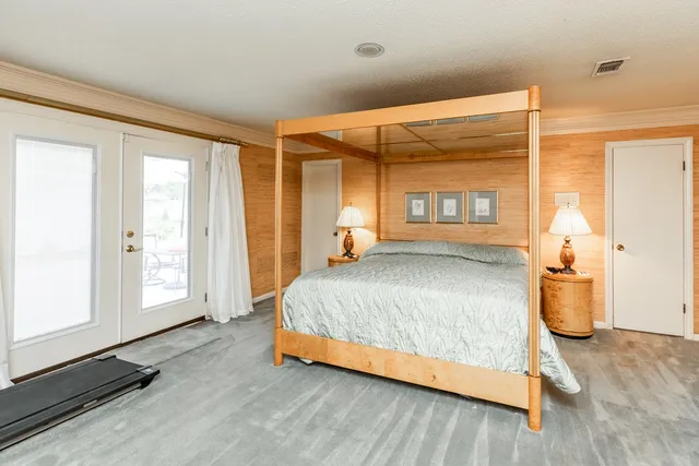a view of a patio with table and chairs under an umbrella