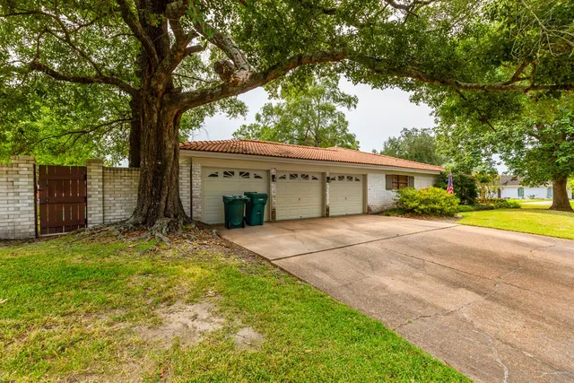 a living room with furniture a rug and a window