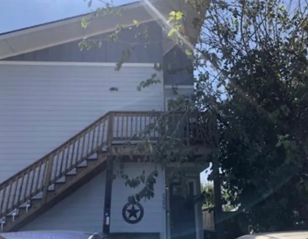 a kitchen with a sink and a refrigerator