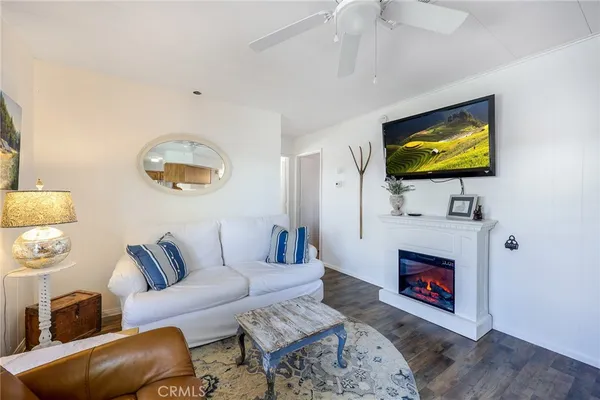 a view of kitchen with kitchen island stainless steel appliances refrigerator sink and cabinets