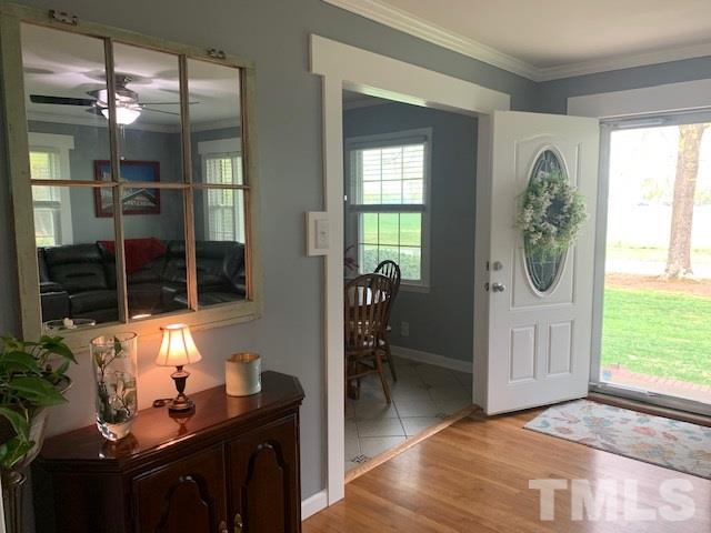 8609 Cassam Road Bahama, NC 27503 - Photo 12 of 23 a bathroom with a sink a mirror and a window