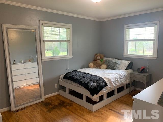 8609 Cassam Road Bahama, NC 27503 - Photo 16 of 23 a bedroom with a bed and window