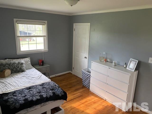 8609 Cassam Road Bahama, NC 27503 - Photo 17 of 23 a bedroom with a bed and window