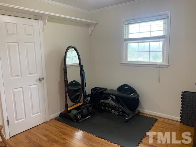 8609 Cassam Road Bahama, NC 27503 - Photo 18 of 23 a room with window and a wooden floor