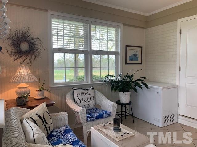 8609 Cassam Road Bahama, NC 27503 - Photo 21 of 23 a living room with furniture and a potted plant