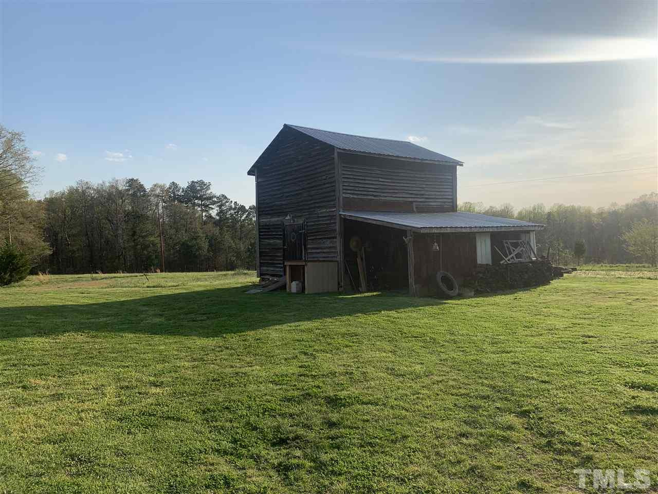 8609 Cassam Road Bahama, NC 27503 - Photo 5 of 23 a front view of a house with a yard