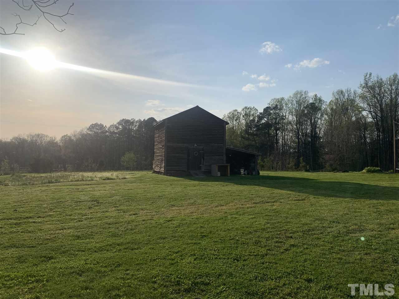 8609 Cassam Road Bahama, NC 27503 - Photo 6 of 23 a big yard with lots of green space and mountain view in back