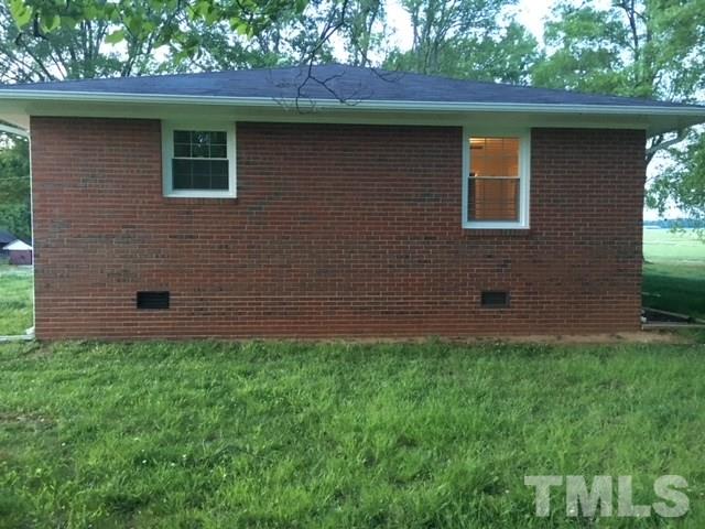 8609 Cassam Road Bahama, NC 27503 - Photo 10 of 23 a brick house with a outdoor space
