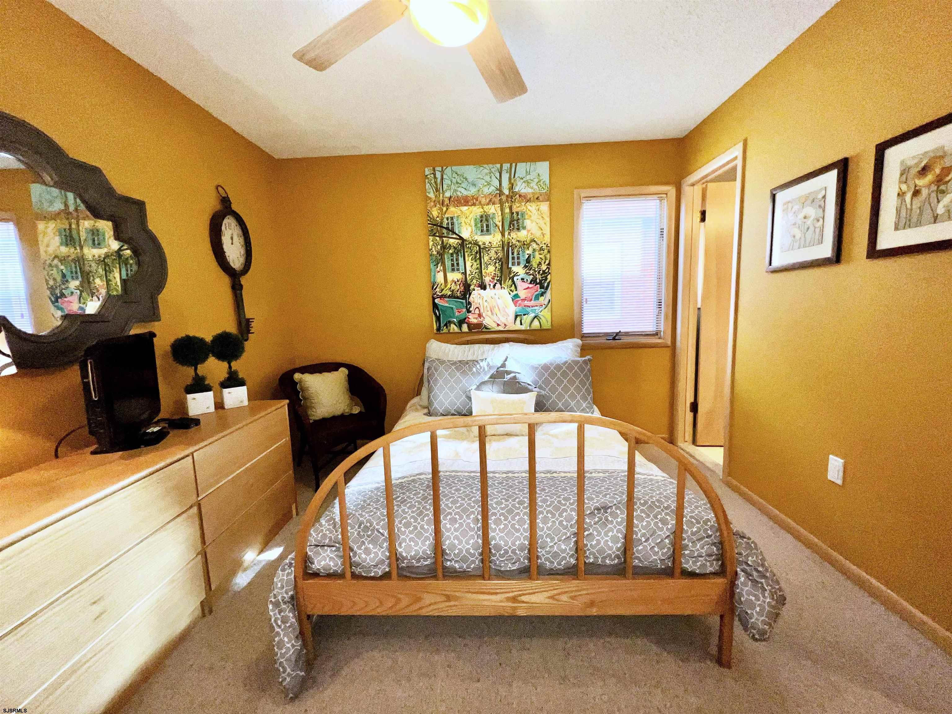 211 3rd Street North, Unit B Brigantine, NJ 08203 - Photo 12 of 52 a view of staircase with furniture and windows