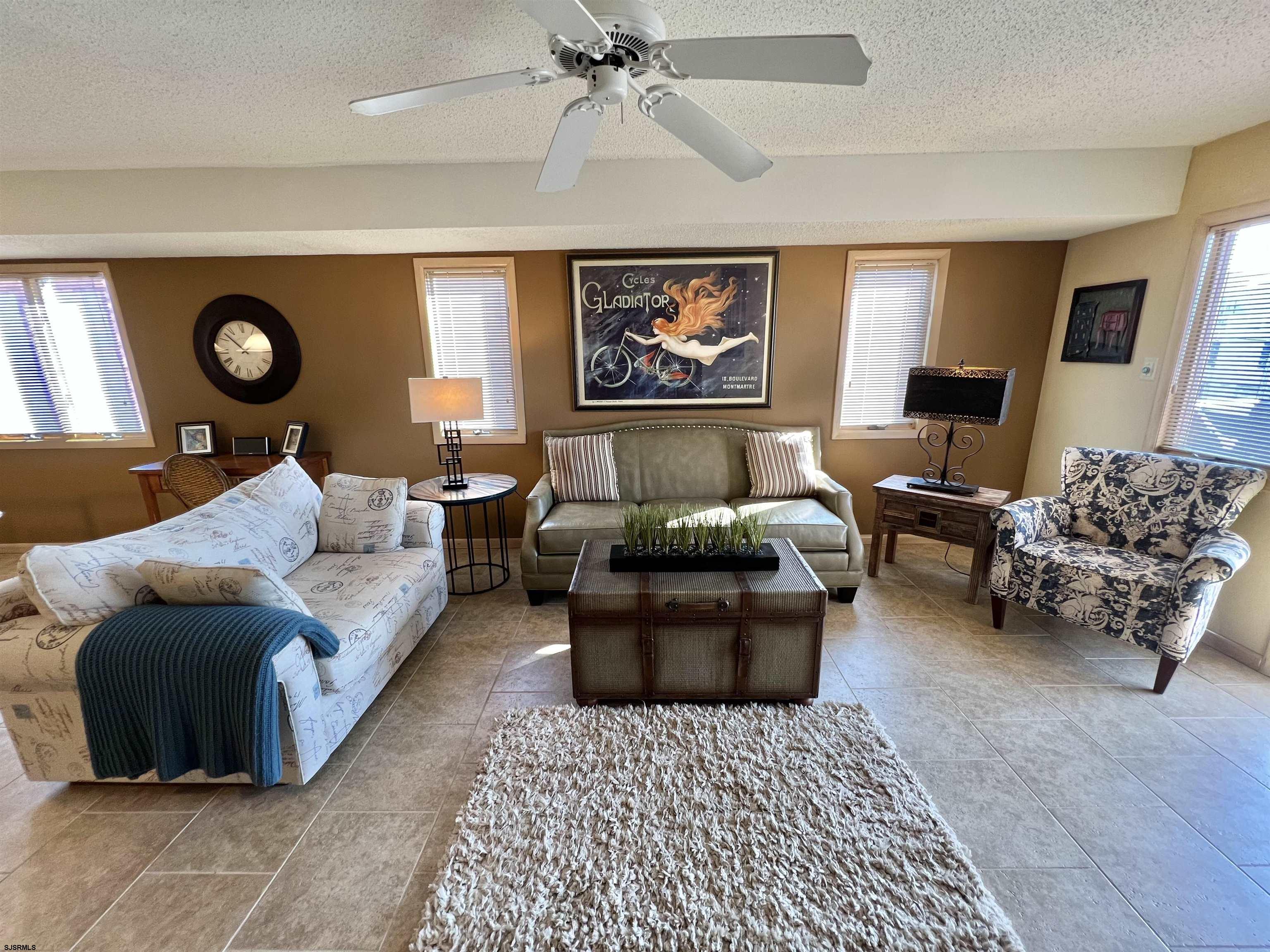 211 3rd Street North, Unit B Brigantine, NJ 08203 - Photo 15 of 52 a living room with furniture and a large window