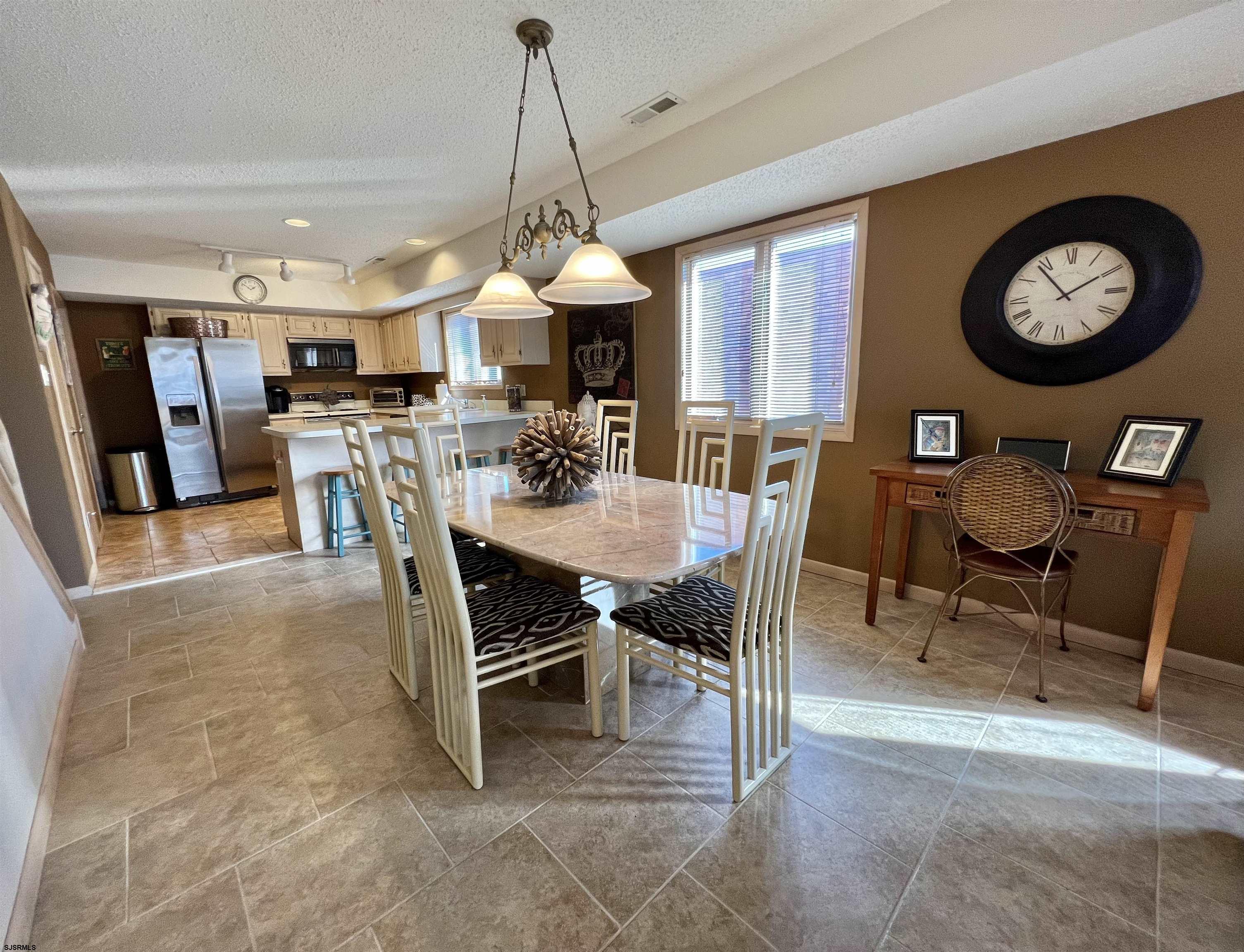 211 3rd Street North, Unit B Brigantine, NJ 08203 - Photo 18 of 52 a view of a dining room and livingroom view