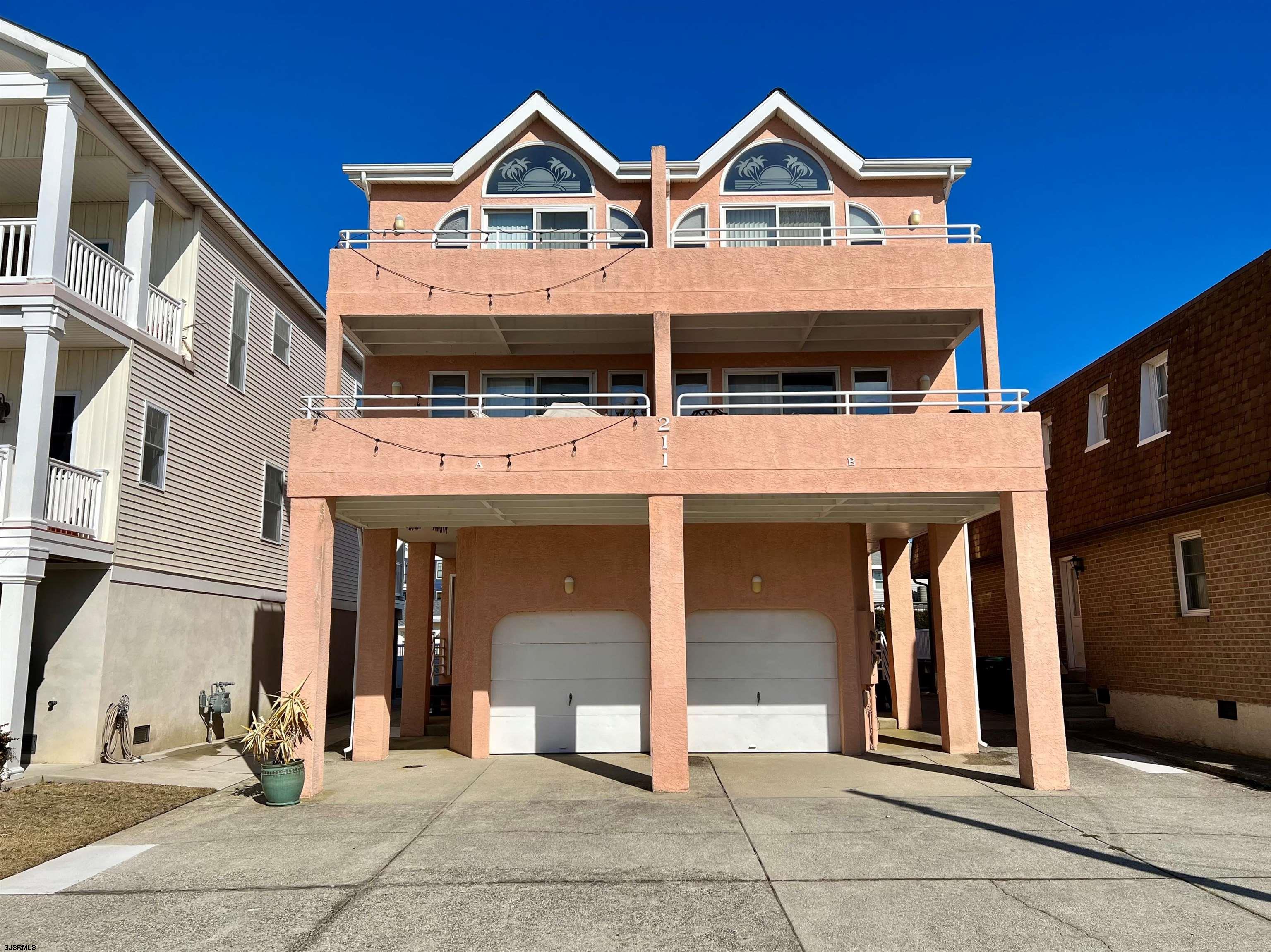 211 3rd Street North, Unit B Brigantine, NJ 08203 - Photo 2 of 52 a view of a house with large windows