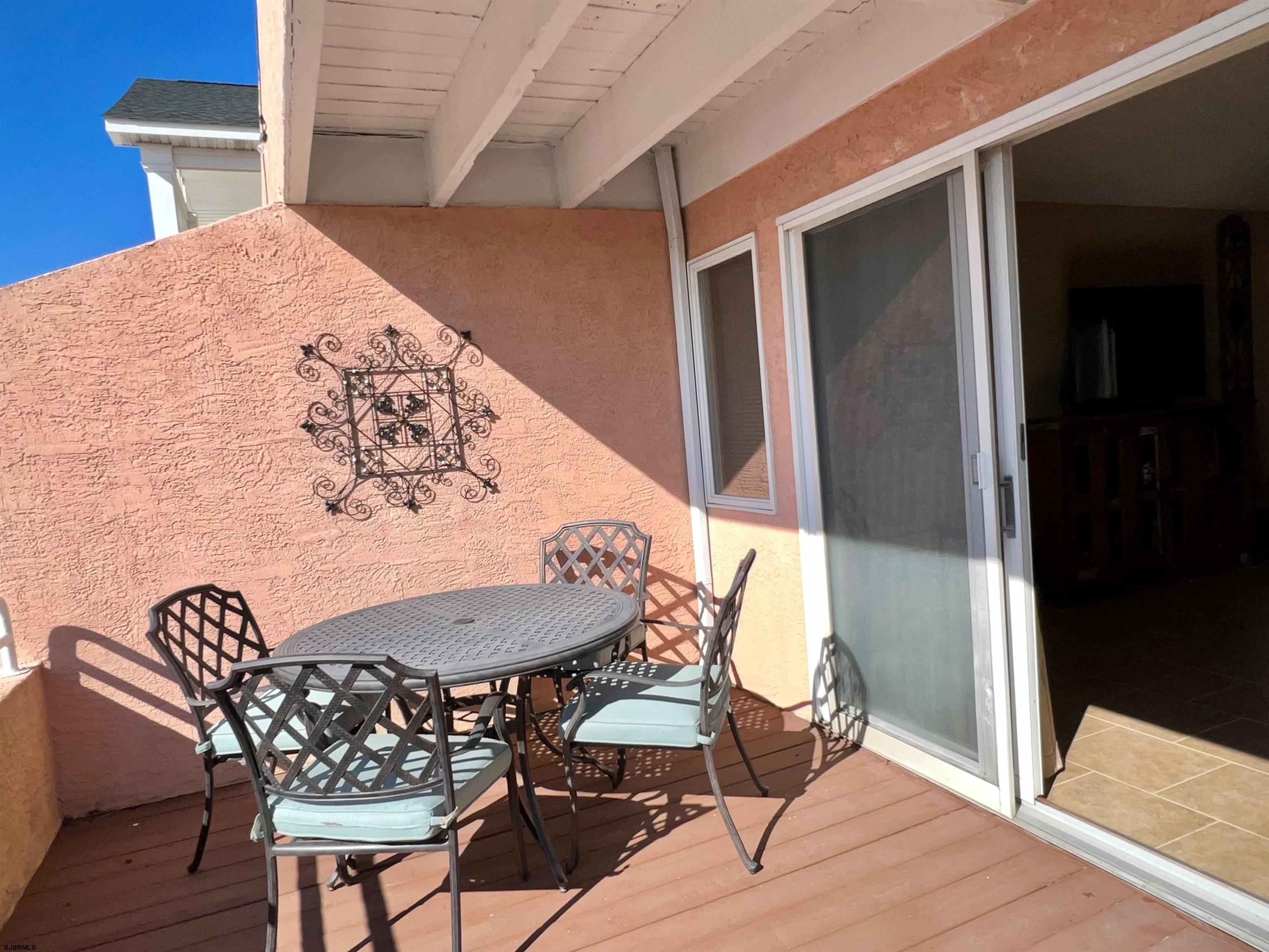 211 3rd Street North, Unit B Brigantine, NJ 08203 - Photo 25 of 52 a view of a dining room with furniture and wooden floor