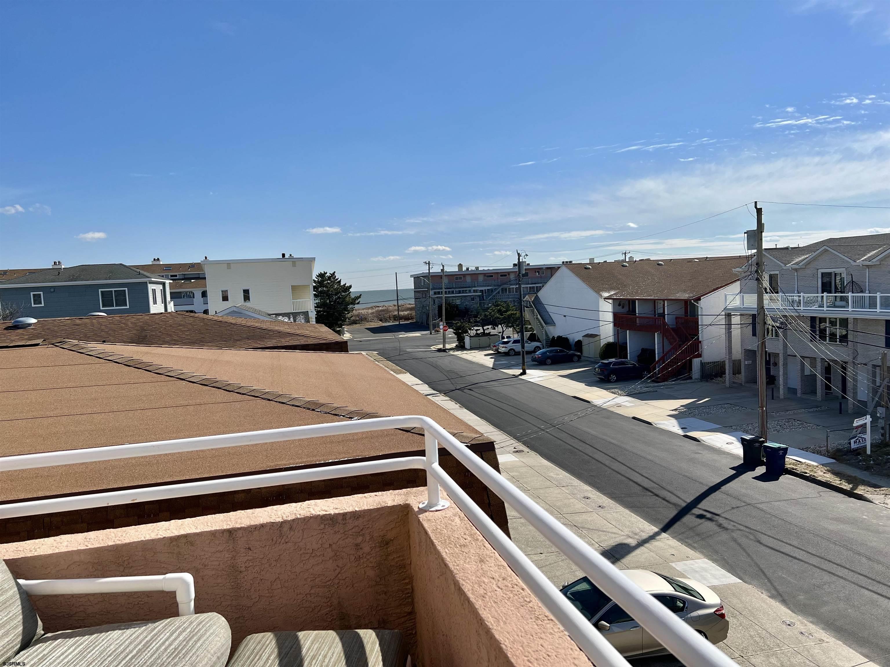 211 3rd Street North, Unit B Brigantine, NJ 08203 - Photo 31 of 52 a view of a balcony with chairs