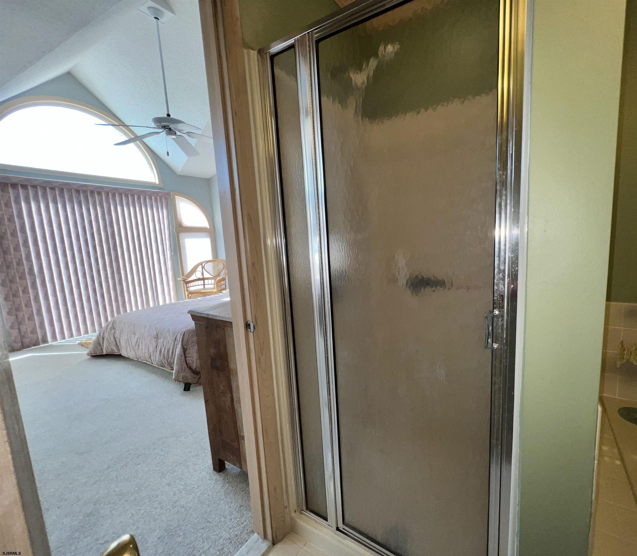 211 3rd Street North, Unit B Brigantine, NJ 08203 - Photo 36 of 52 a view of a room that has a bed and a window