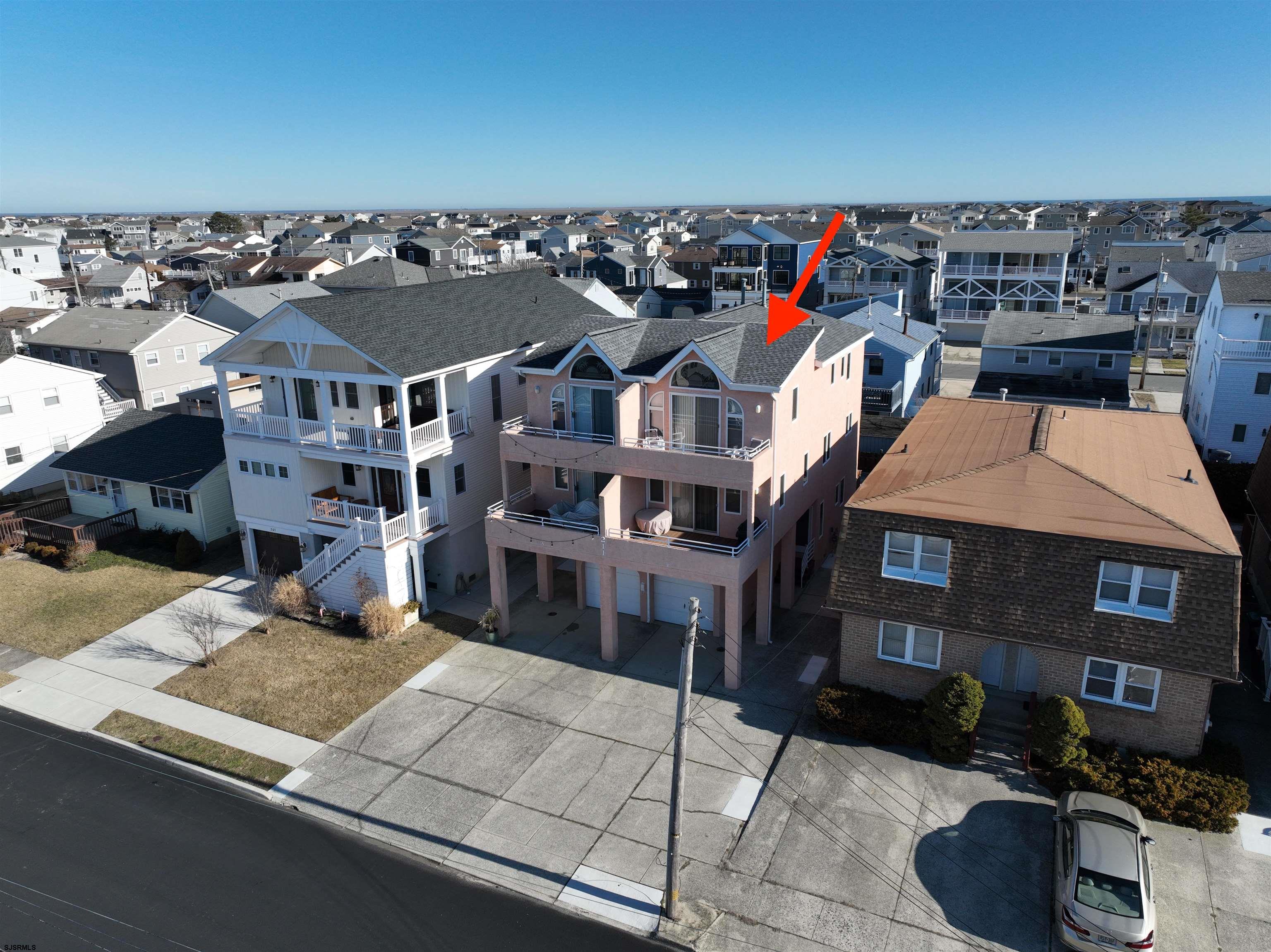 211 3rd Street North, Unit B Brigantine, NJ 08203 - Photo 46 of 52 a view of a house with a patio