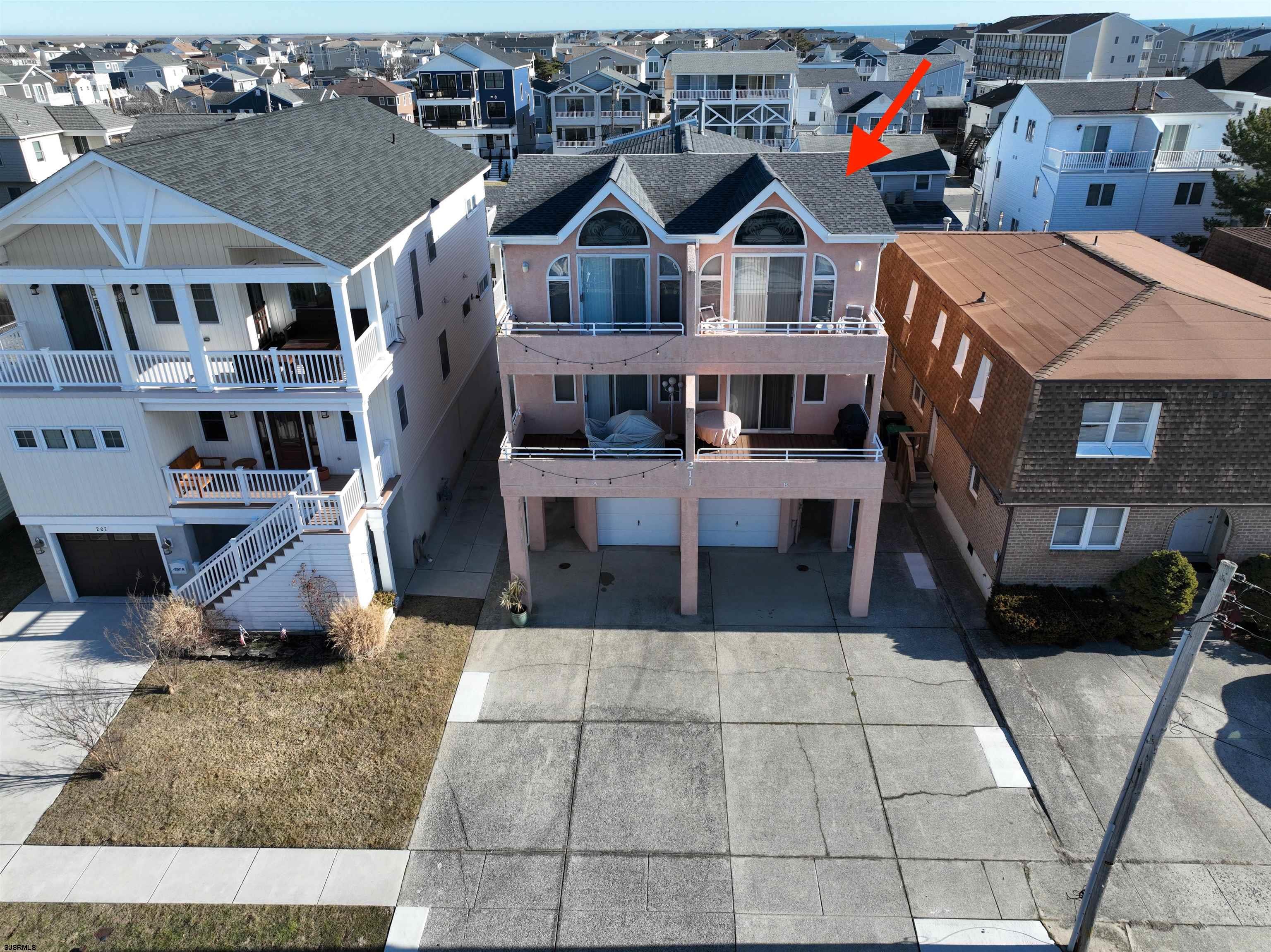 211 3rd Street North, Unit B Brigantine, NJ 08203 - Photo 47 of 52 a view of multiple houses with a rug