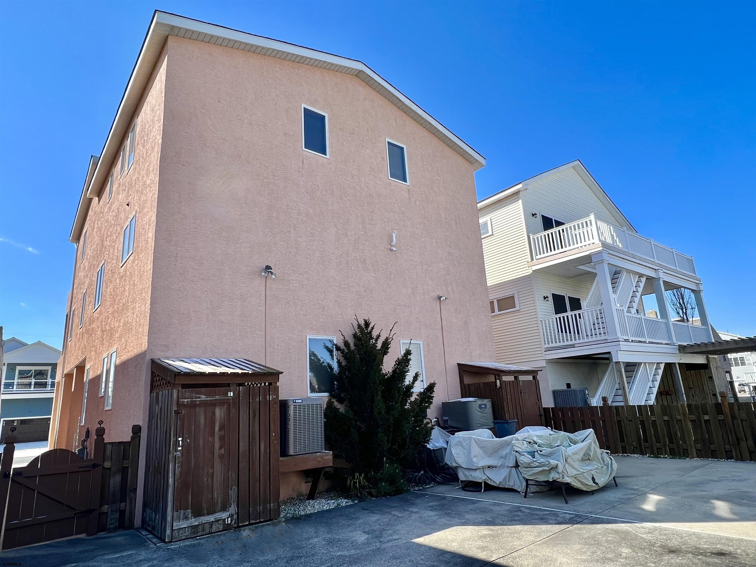 211 3rd Street North, Unit B Brigantine, NJ 08203 - Photo 6 of 52 a front view of a house with yard