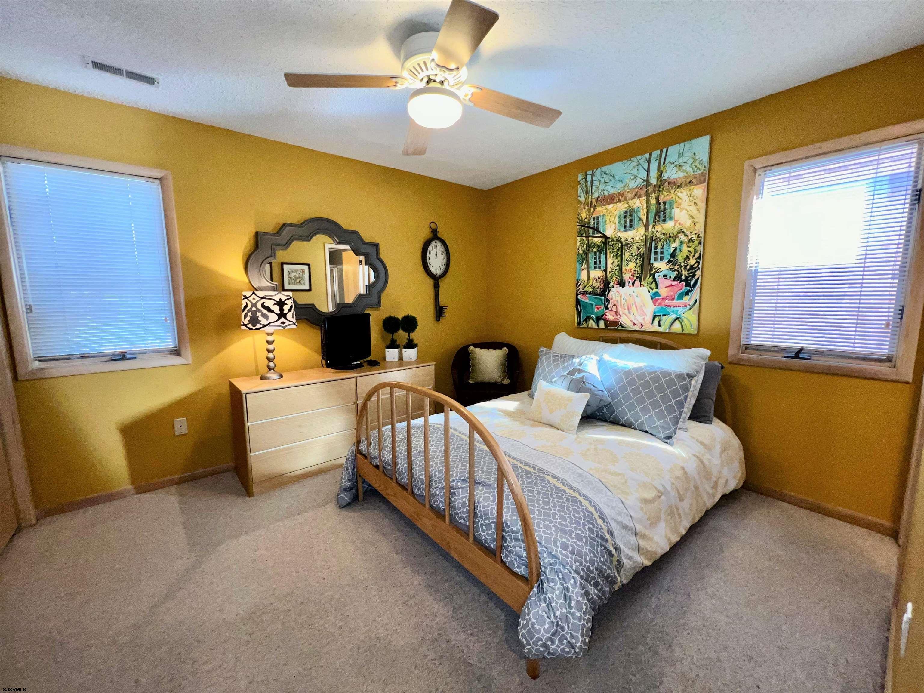 211 3rd Street North, Unit B Brigantine, NJ 08203 - Photo 10 of 52 a bed room with two beds and a window