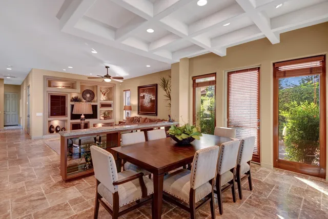a view of a dining room with furniture window and outside view