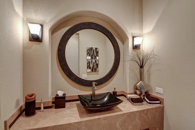 a room with a mirror and fan