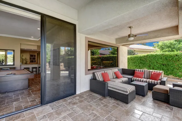 a outdoor living space with furniture and a potted plant