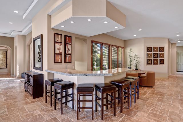 a view of a dining room with furniture and window