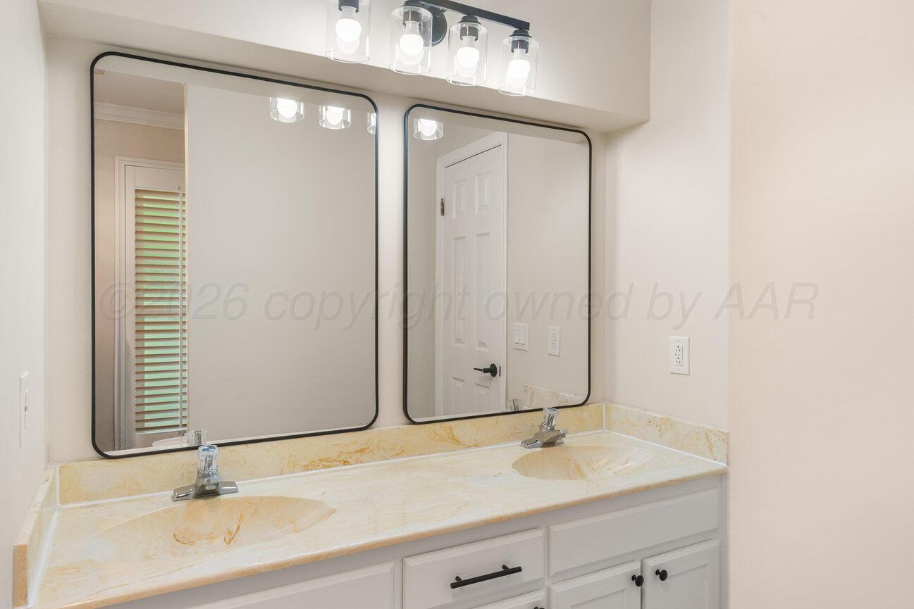 7204 Southwest 39th Avenue Amarillo, TX 79109 - Photo 43 of 51 a bathroom with a sink and a mirror