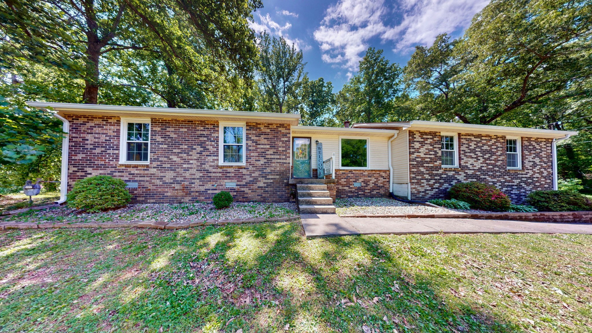 268 Raymond Hodges Road Cottontown, TN 37048 - Photo 1 of 38 a view of a house with a backyard