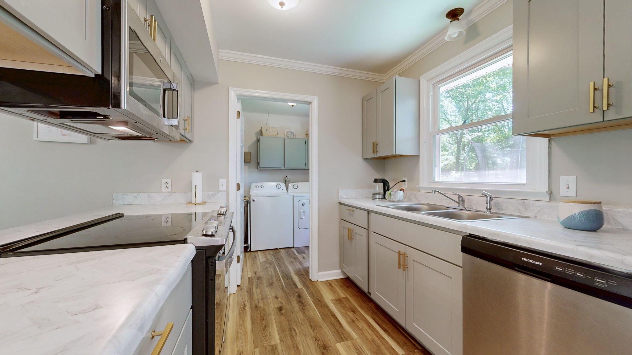 268 Raymond Hodges Road Cottontown, TN 37048 - Photo 11 of 38 a kitchen with a sink stove and microwave