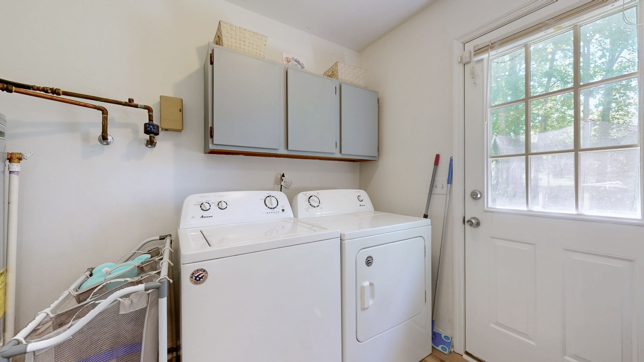 268 Raymond Hodges Road Cottontown, TN 37048 - Photo 13 of 38 a view of storage and utility room with washer and dryer