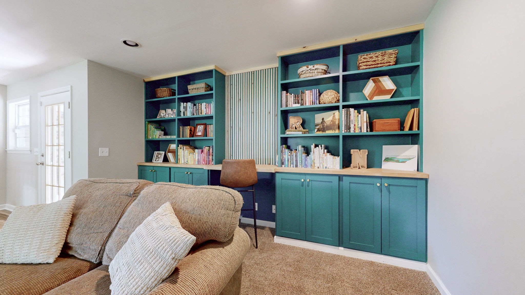 268 Raymond Hodges Road Cottontown, TN 37048 - Photo 18 of 38 a living room with furniture and a book shelf