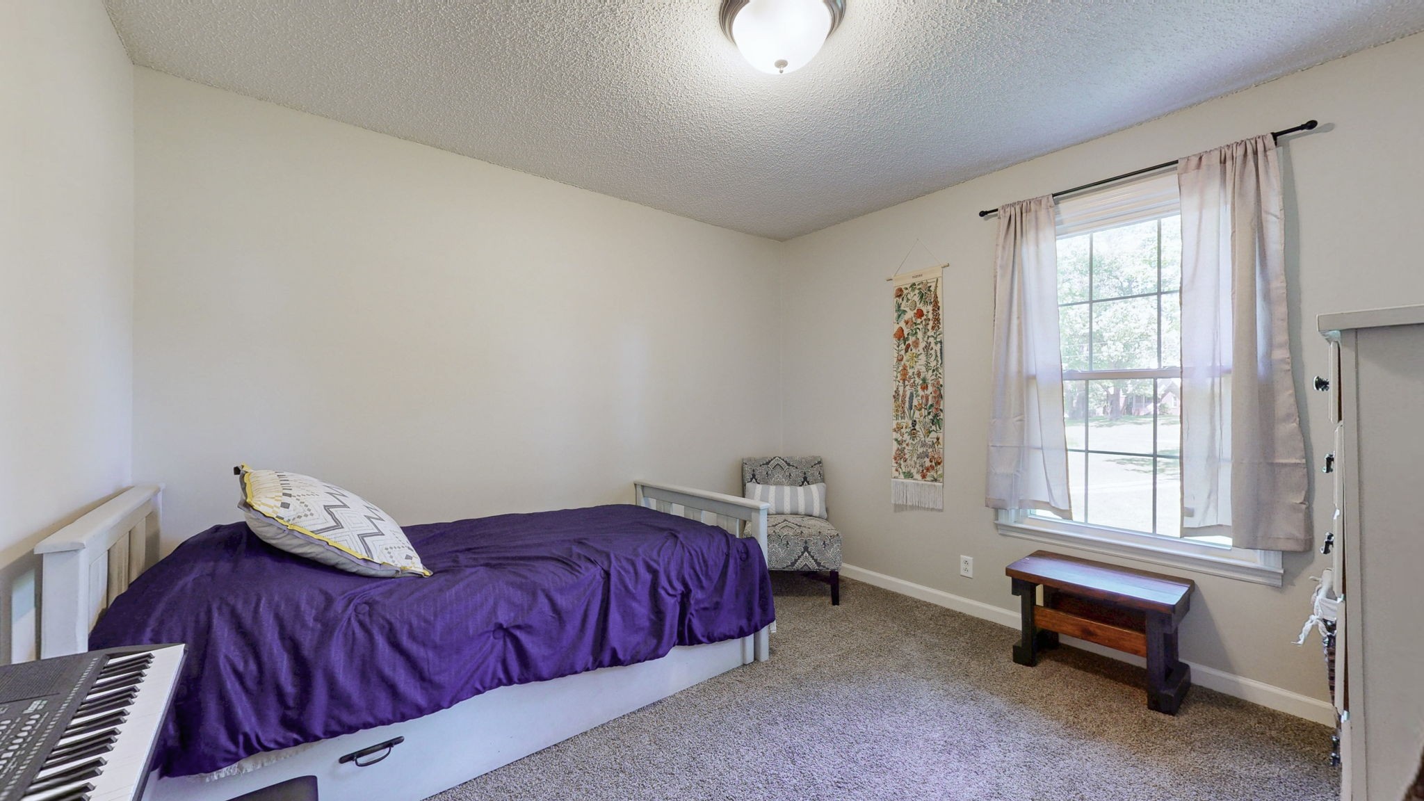 268 Raymond Hodges Road Cottontown, TN 37048 - Photo 20 of 38 a bedroom with a bed and a window