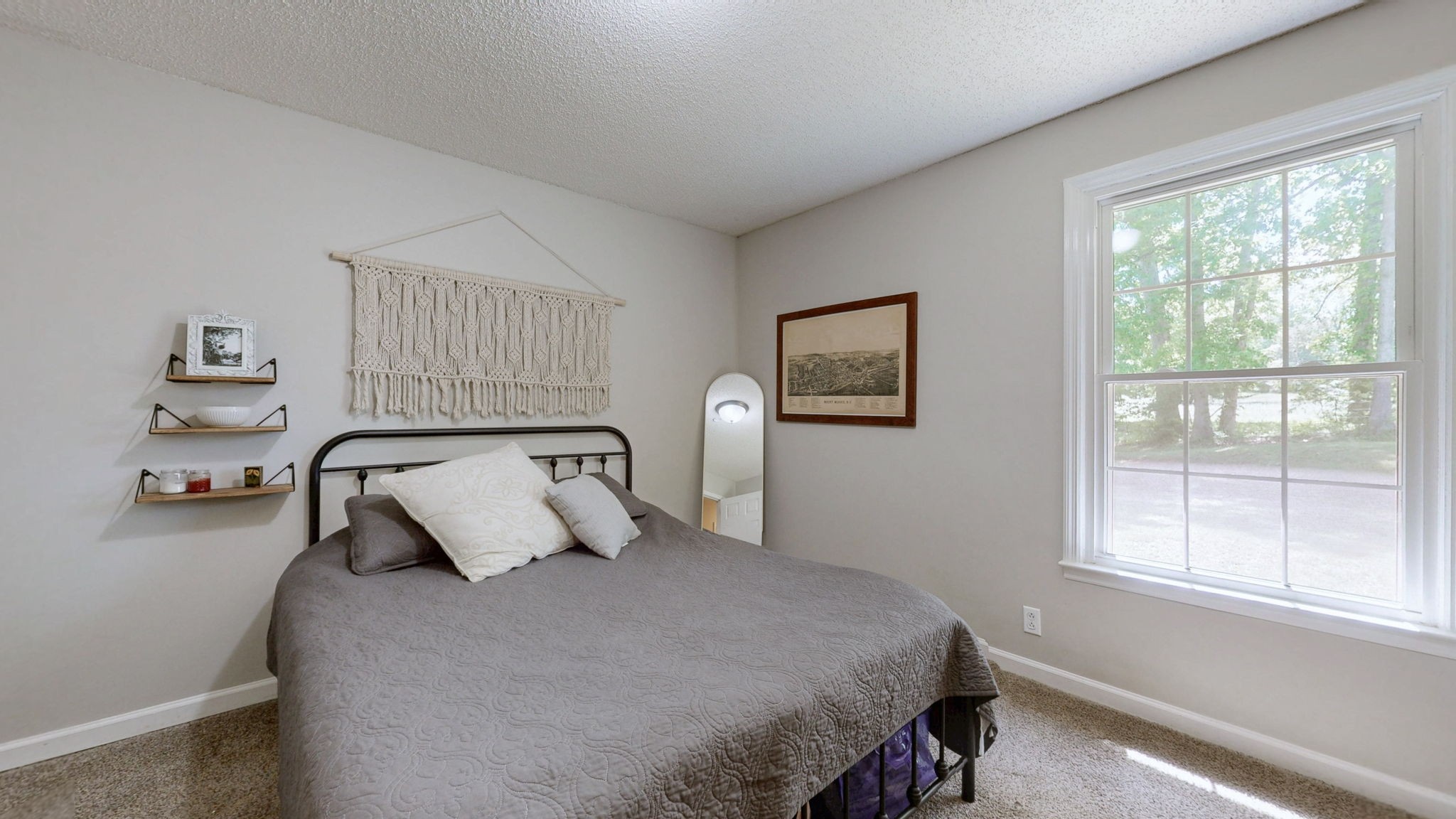 268 Raymond Hodges Road Cottontown, TN 37048 - Photo 24 of 38 a bedroom with a bed and window