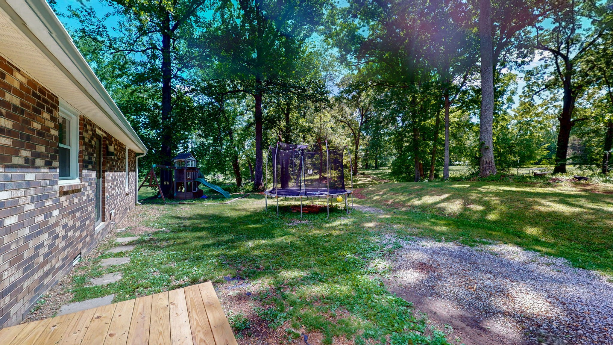 268 Raymond Hodges Road Cottontown, TN 37048 - Photo 28 of 38 a view of a garden with a tree