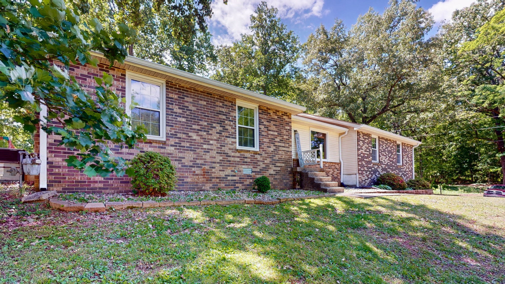 268 Raymond Hodges Road Cottontown, TN 37048 - Photo 3 of 38 a view of a house with a yard