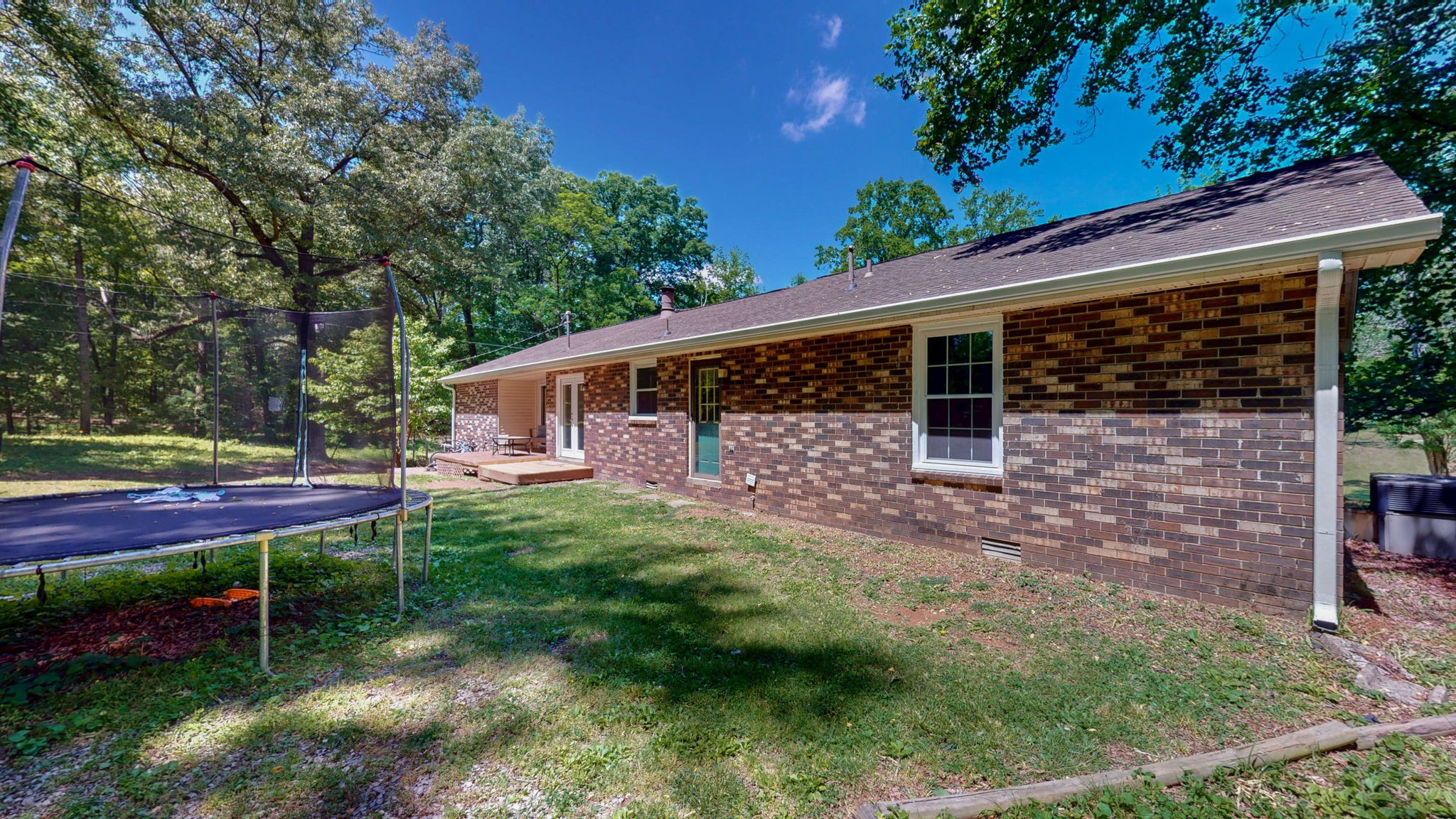 268 Raymond Hodges Road Cottontown, TN 37048 - Photo 34 of 38 a backyard of a house with seating space