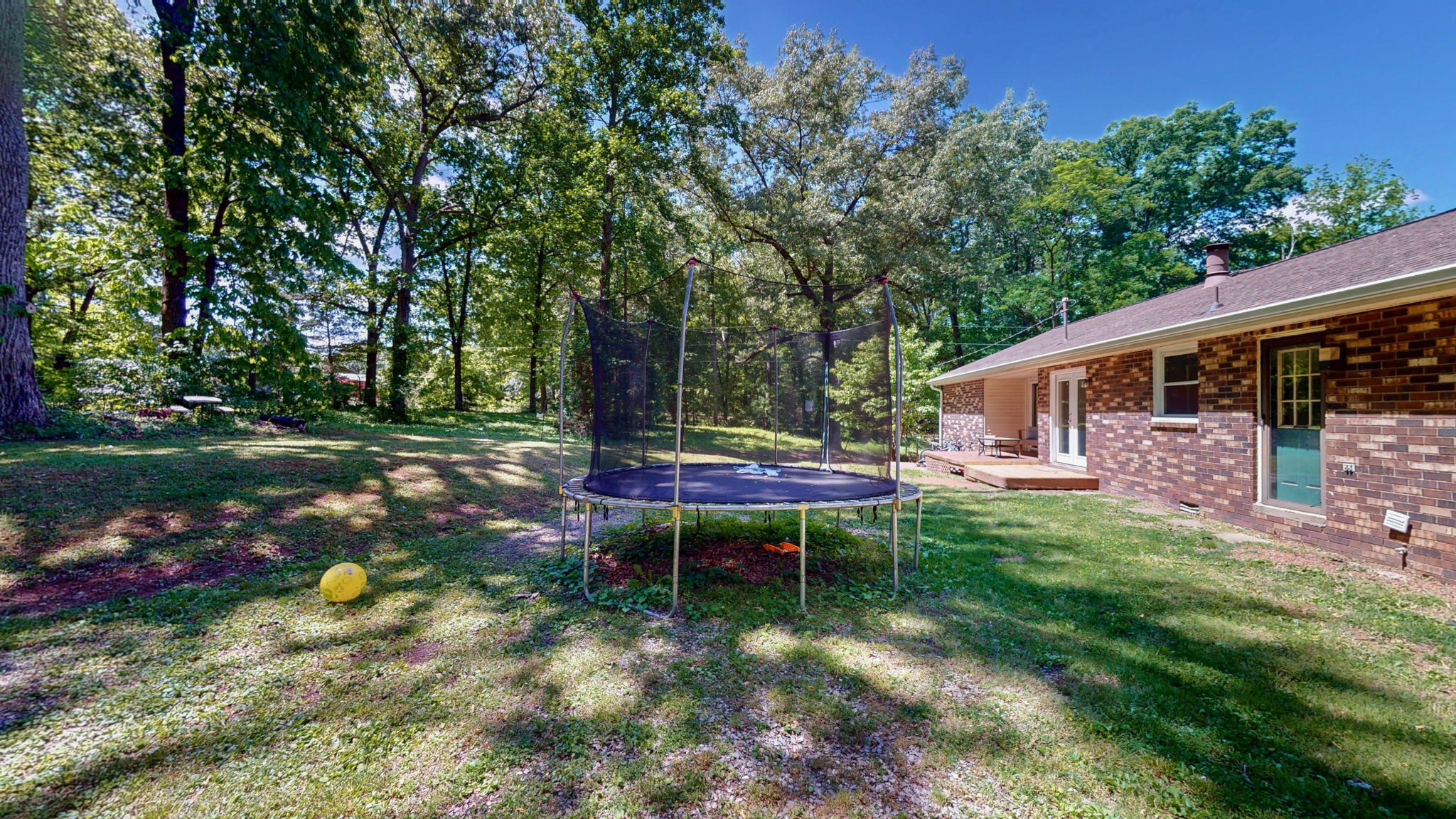 268 Raymond Hodges Road Cottontown, TN 37048 - Photo 37 of 38 a backyard of a house with table and chairs